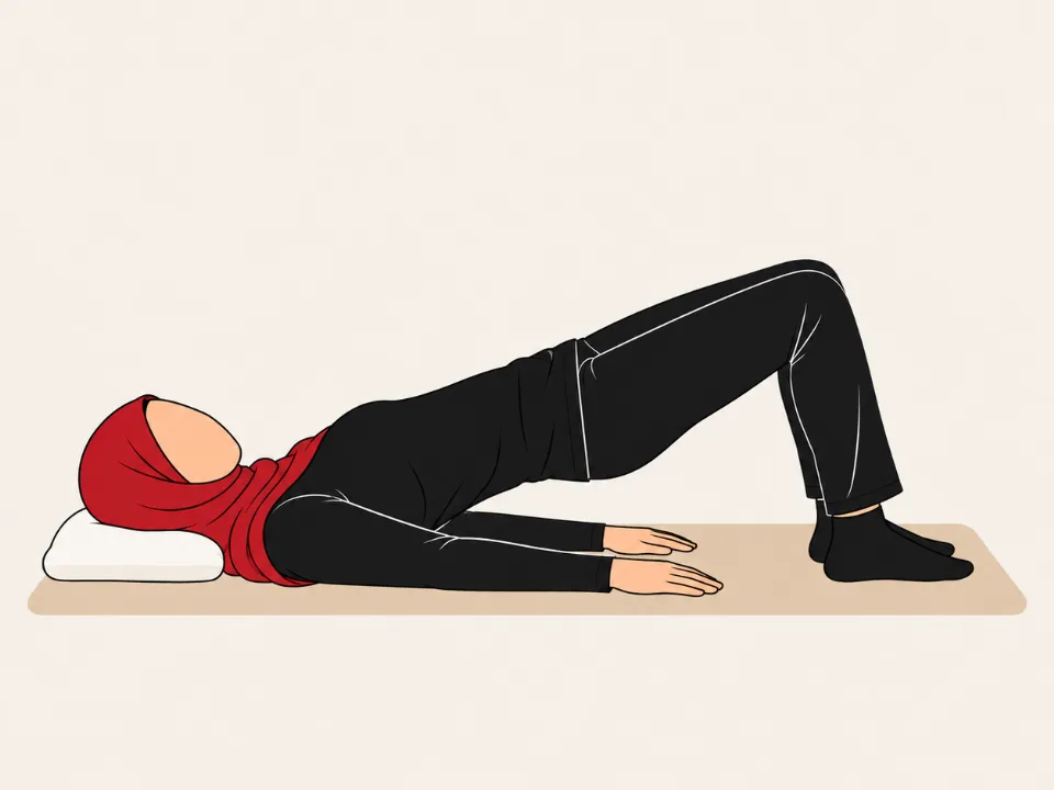 Woman in a red hijab lying on her back with knees bent, lifting her hips into a bridge.