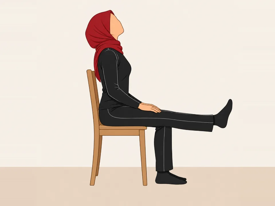 Woman in a red hijab sitting on a chair, straightening one knee as she tips her head back.