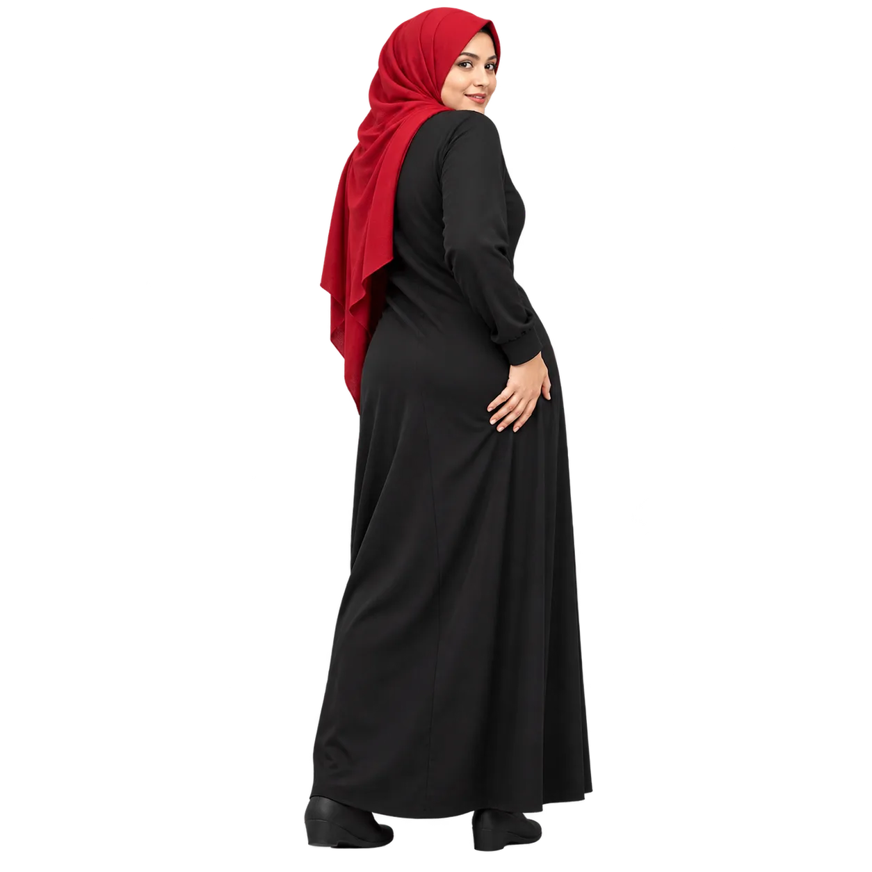 AI-generated fictional Pakistani woman in a red hijab and modest black dress, standing with her hand near her buttock.